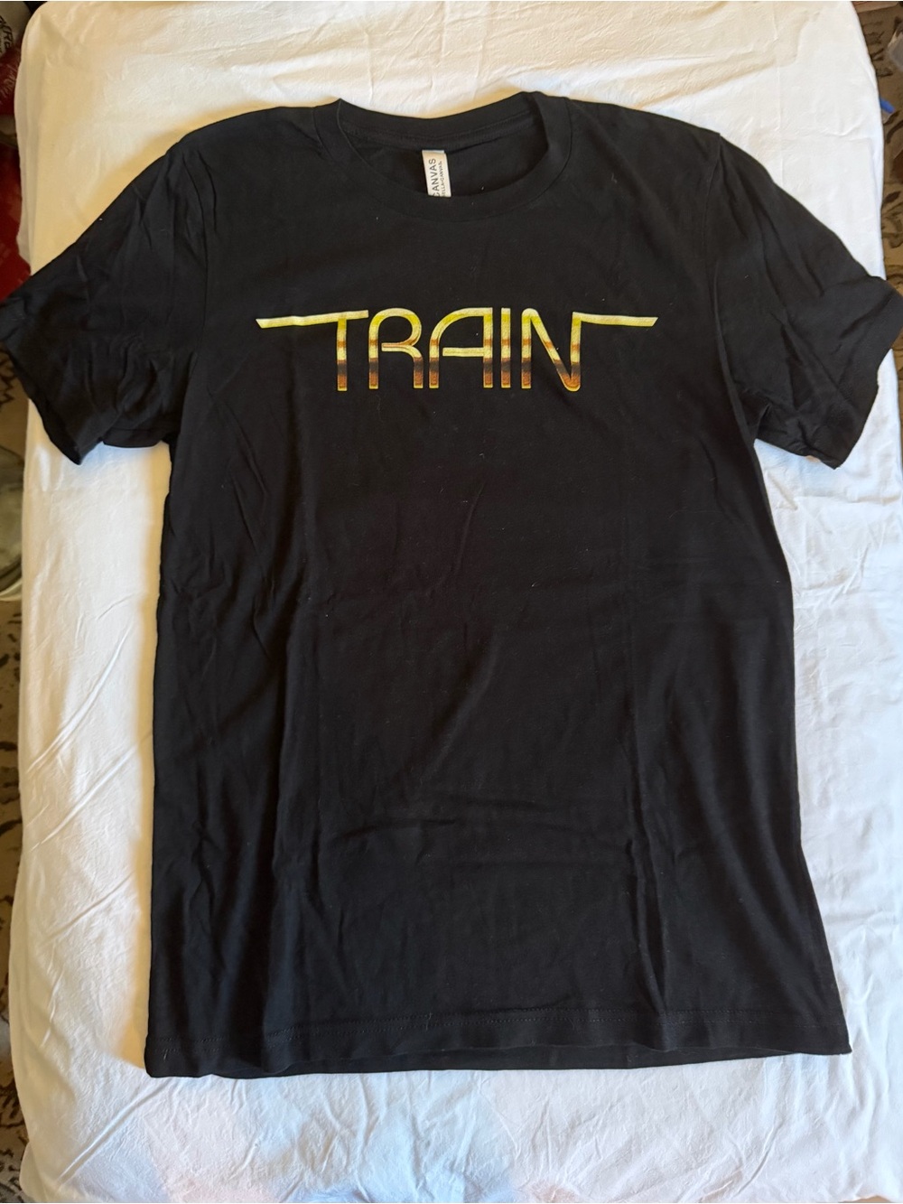 Women’s Bella Canvas Black T-Shirt with Gold TRAIN Logo